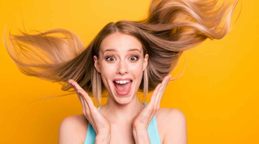 happy lady with hair strewn around her | PepFactor: Unique Protein for Skin & Hair Rejuvenation | Bergen County Hair Loss