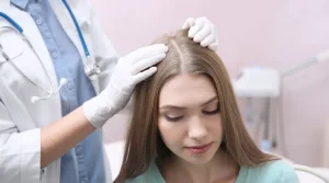 a Scalp Specialist checking the scalp of the women